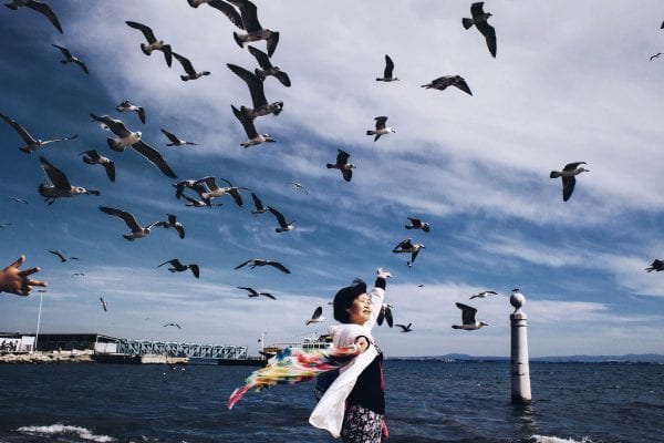 woman with birds, street photography of a person, by efi logginou