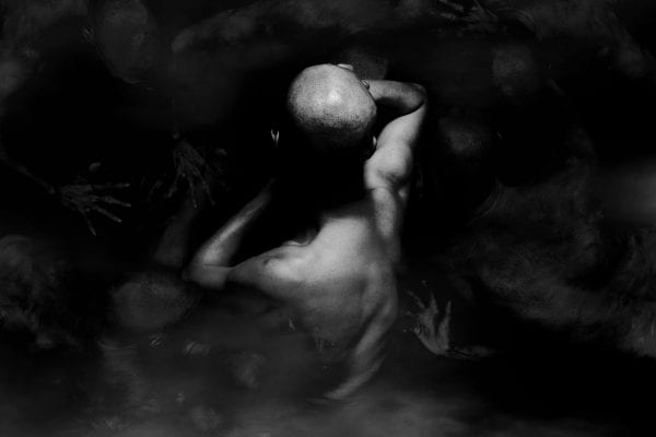 black and white photography of human bodies on a dark background by Korean Photographer Dongwook Lee