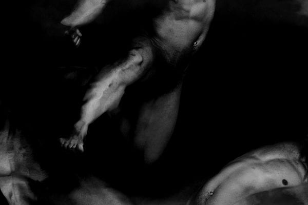 black and white photography of human bodies on a dark background by Korean Photographer Dongwook Lee