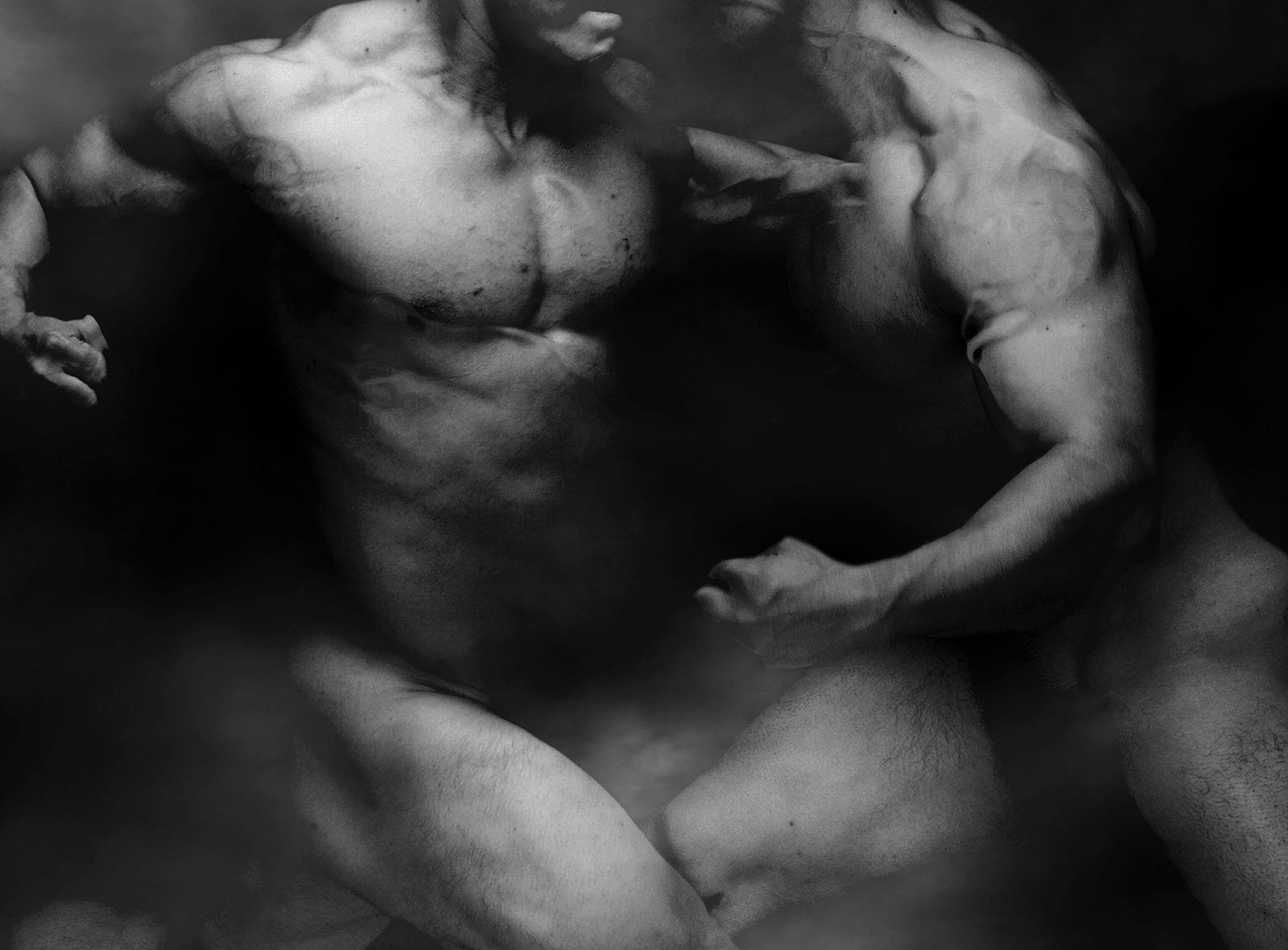 black and white photography of human bodies on a dark background by Korean Photographer Dongwook Lee