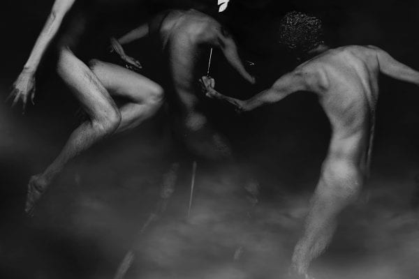 black and white photography of human bodies on a dark background by Korean Photographer Dongwook Lee