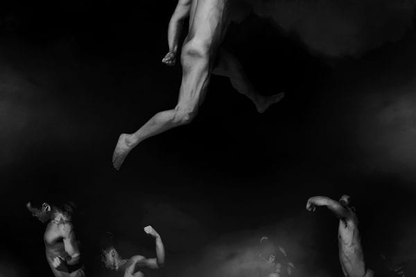 black and white photography of human bodies on a dark background by Korean Photographer Dongwook Lee