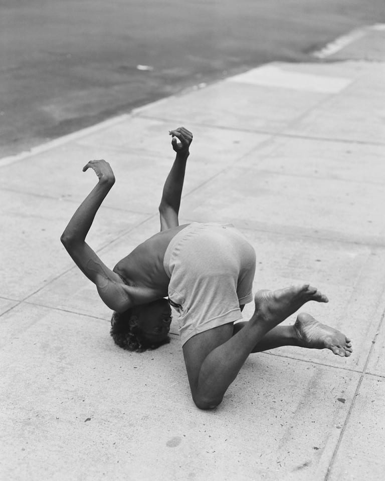 Black and white film portrait photograph of a man in the street by Alexander Klang