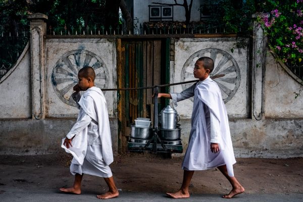 Travel Photography by Alex Zyuzikov - two young monks in the street of Mandalay, Myanmar