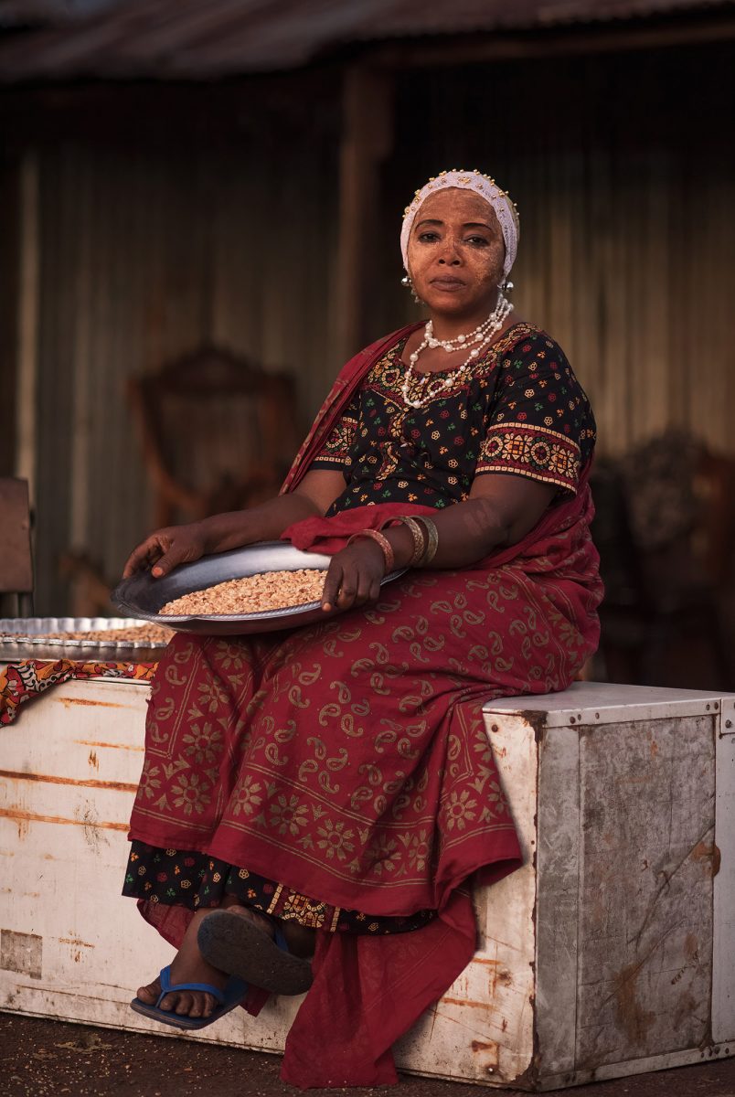 Travel photograph and portrait of a woman in Comoros by Djamil Kemal