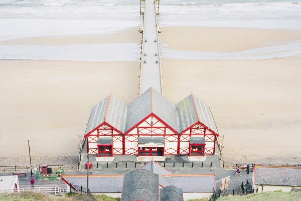 Travel photograph by Frank Lassak of the beach and Saltburn Pier, United Kingdom