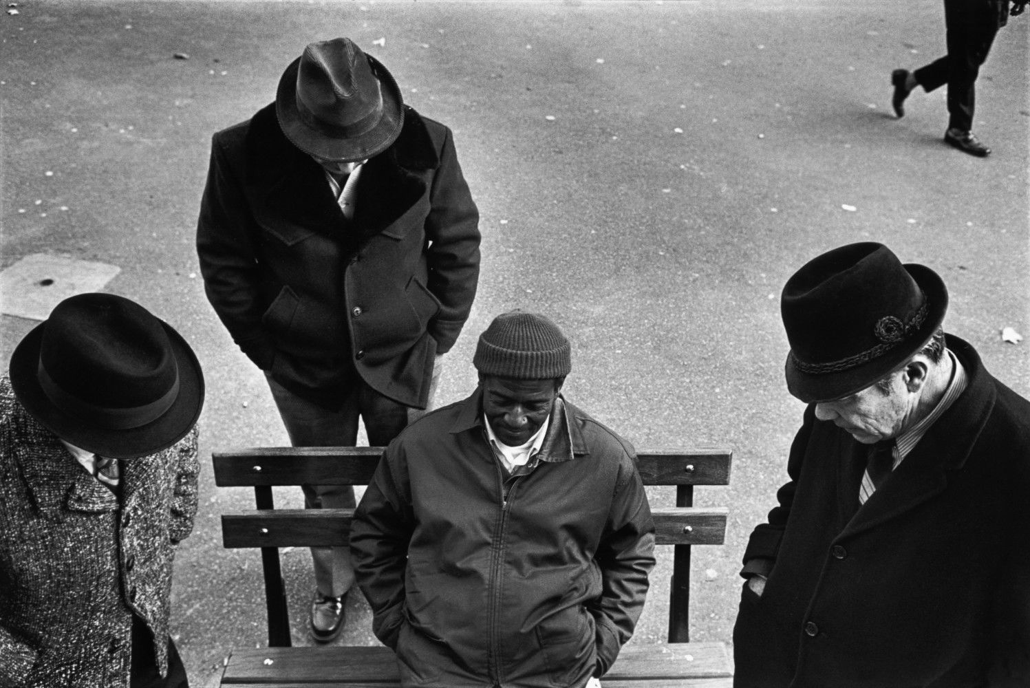 Black and white street photography by Richard Kalvar, a group of men in Washington Square, New York City.