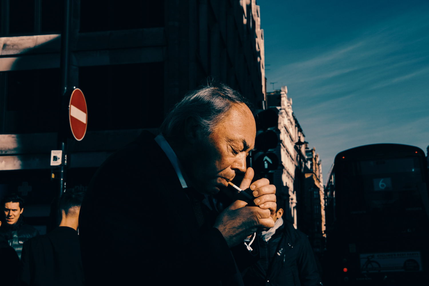 Color street photography by Francesco Gioia, man smoking