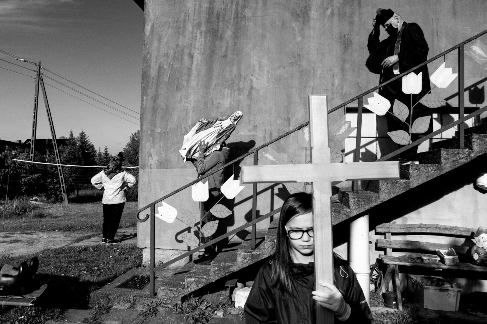 black and white street photo of people in Poland by Szymon Lewinski