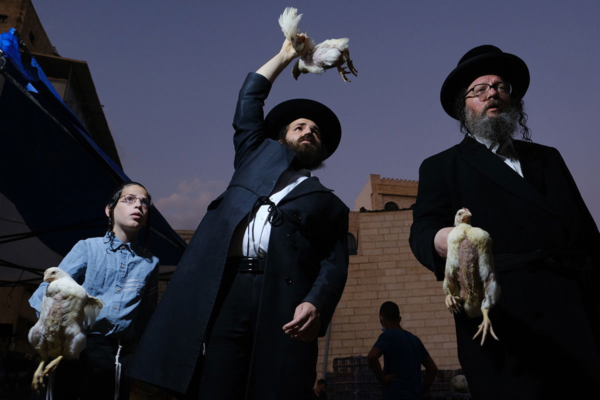 color street photo of people in Bnei Brak, Israel by Orna Naor