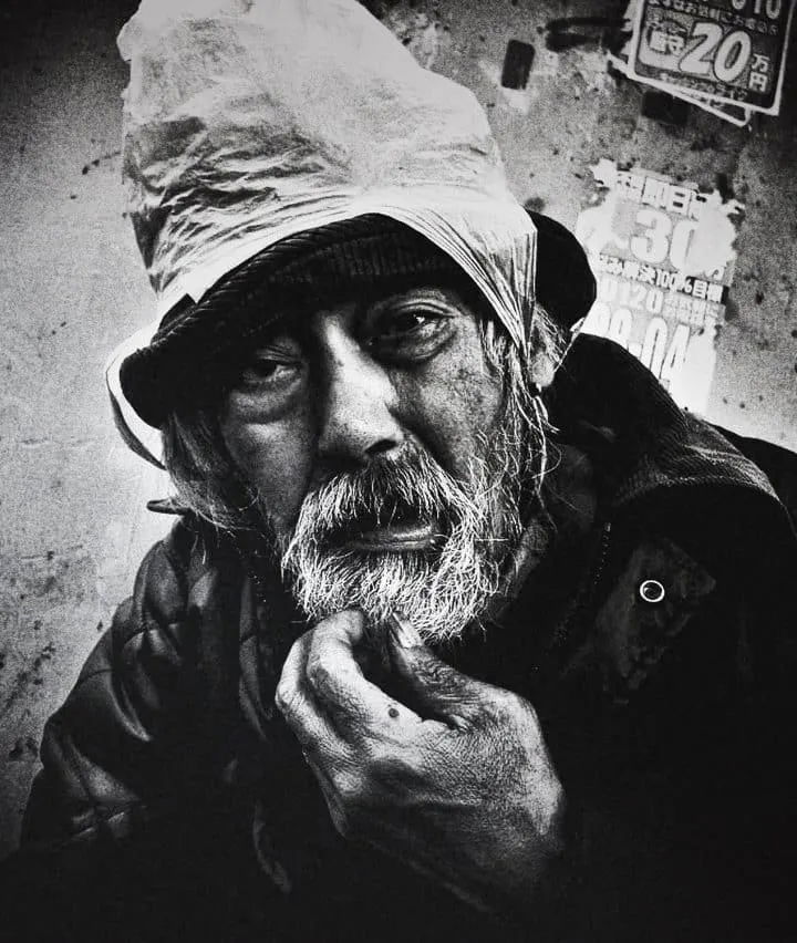 Black and white street photography by Tatsuo Suzuki. close up portrait of elderly man, Tokyo Japan