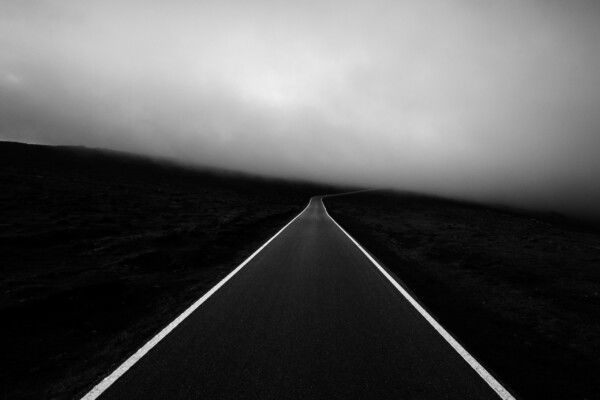 black and white landscape film photo of a road by Alexandre Caetano