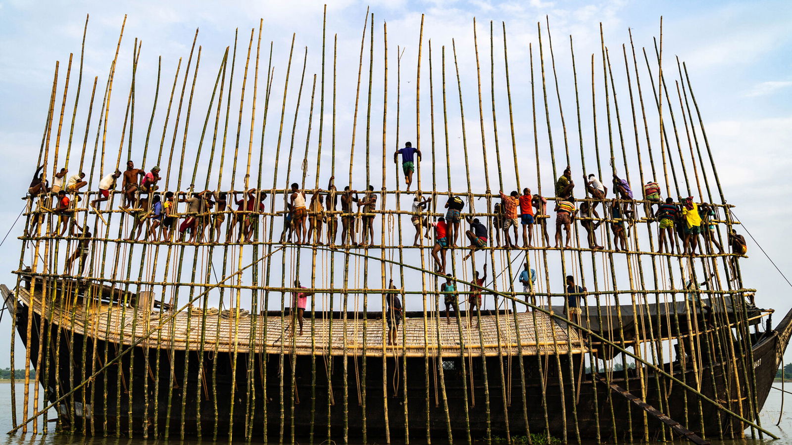 color photograph of men on a boat in Bangladesh by Md Arifuzzaman