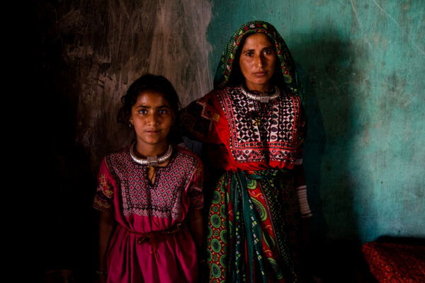 color portrait photo of a girl and a woman in India by Robi Chakraborty