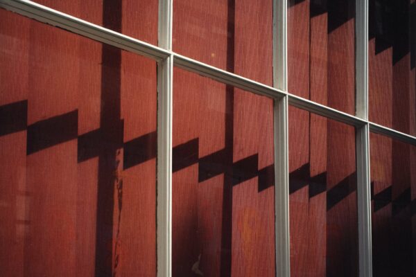 Photography by Phil Sharp, shadows on red curtains