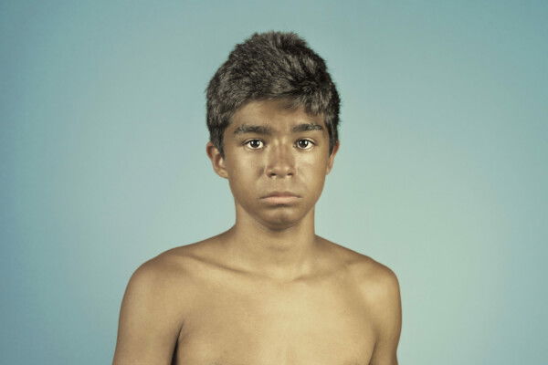 color studio portrait of a boy with dove by Christian Bruni