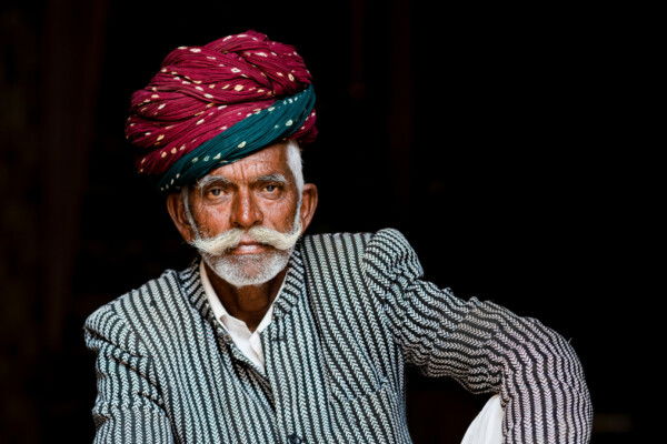 color street candid portrait of an Indian elderly man by Curtis Callaway