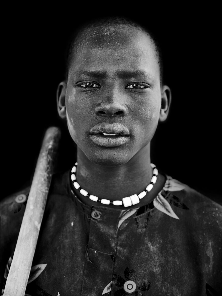 black and white portrait of a cattle herder in south soudan by Karolina Wojtasik