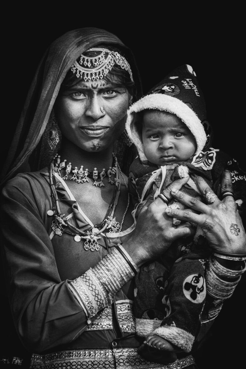 black and white street portrait of an Indian woman and child by Pinkesh Bhati