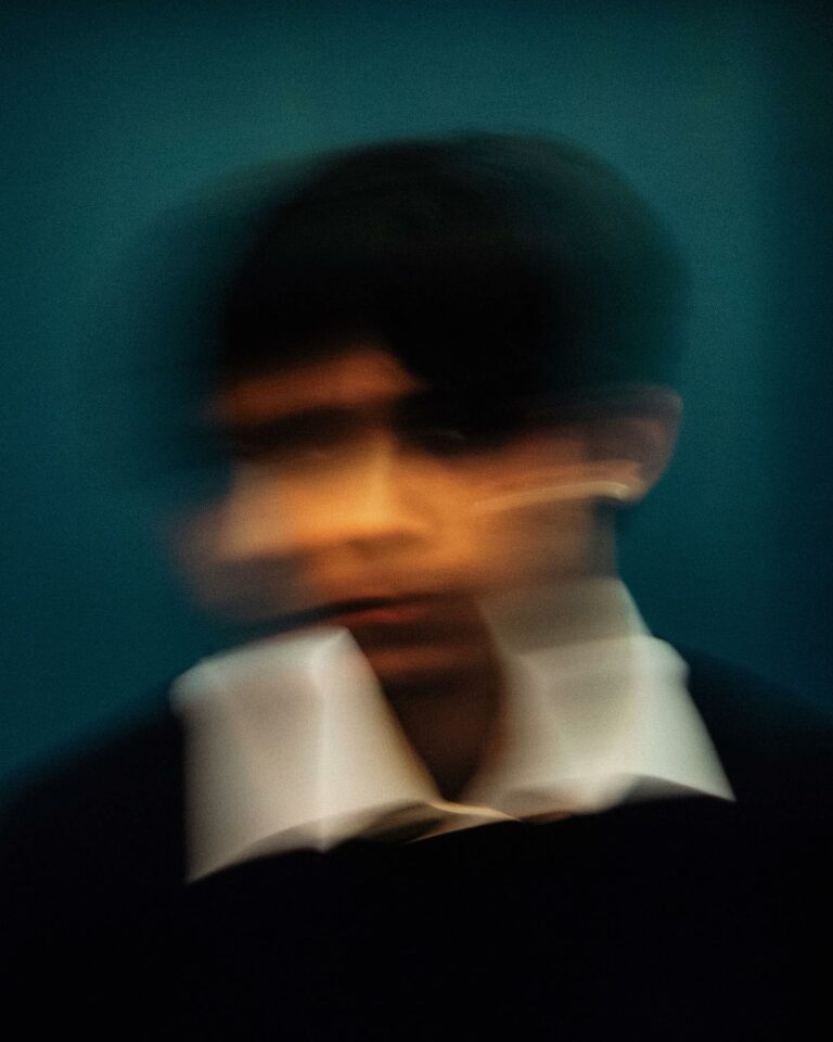 Photography by Joe Clarke. Man's blurred face.