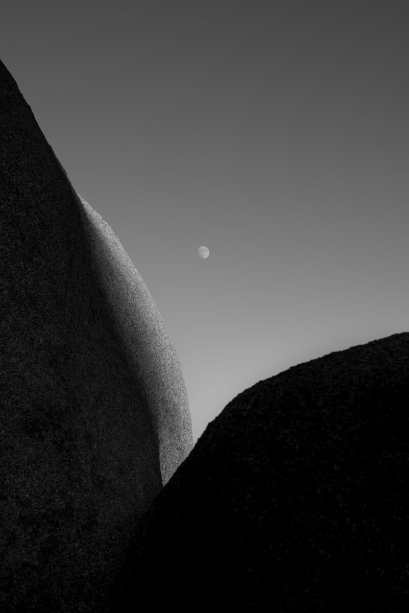 black and white landscape photo of rock formation in Joshua Tree NP, California, United States by William Holderfield