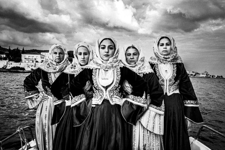 black and white portrait photo of women in traditional clothes in Saronic gulf, Greece by George Tatakis