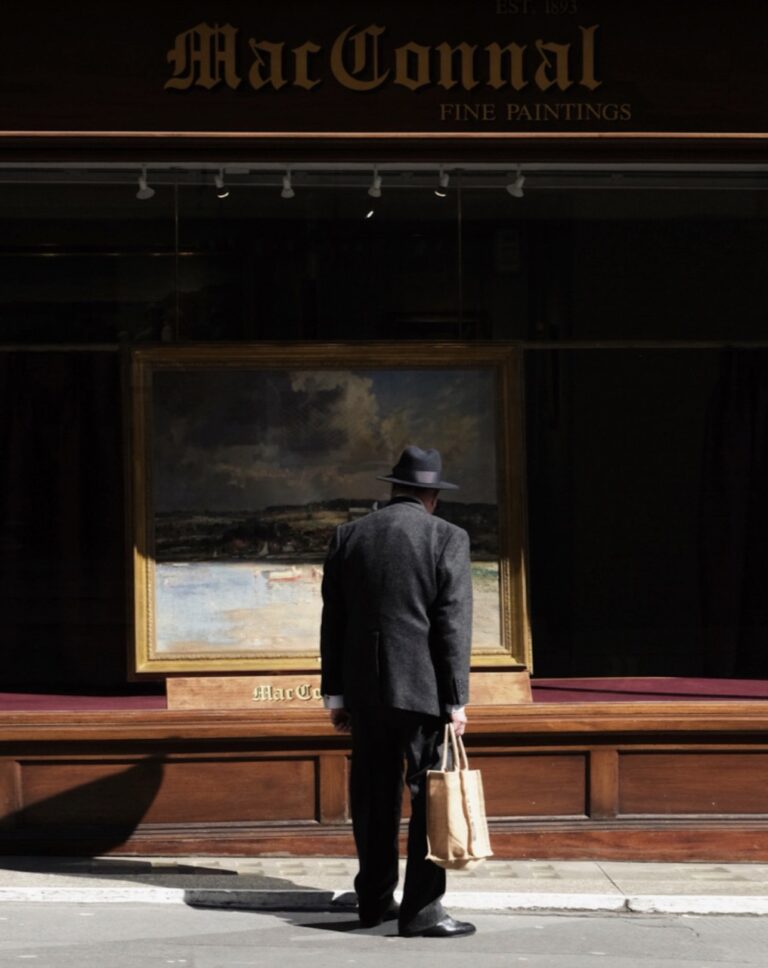 Street photography by Francesco Gioia. Man looking in shop window