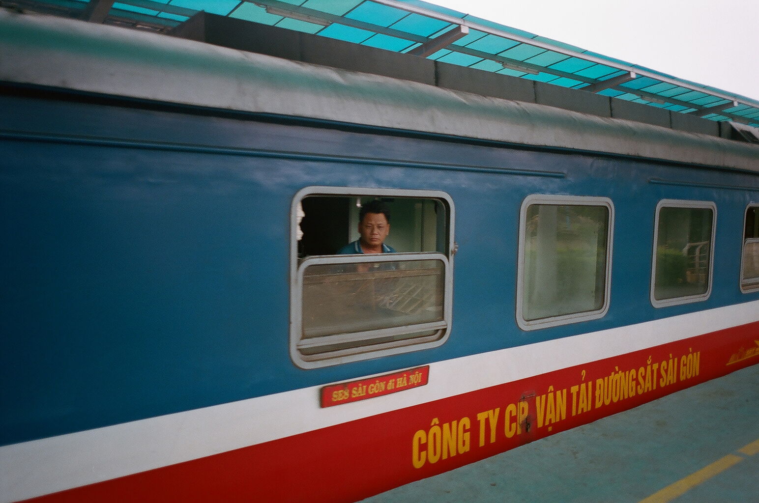 Photo of a man in Vietnamese train by Eric Chakeen