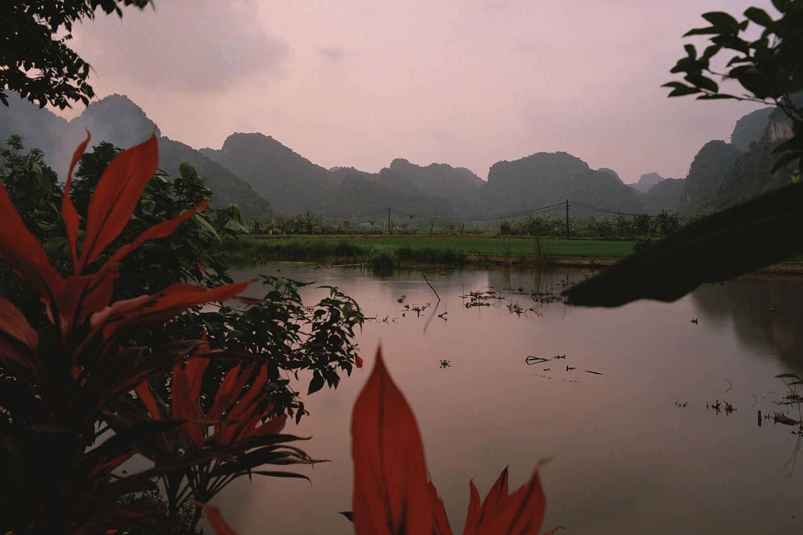 Photography by Eric Chakeen. Lake and mountains. From Golden Triangle