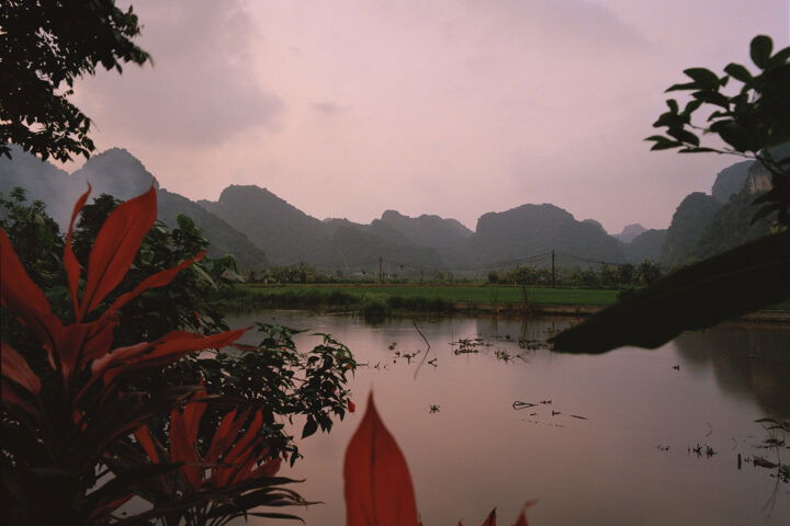 Photography by Eric Chakeen. Lake and mountains. From Golden Triangle