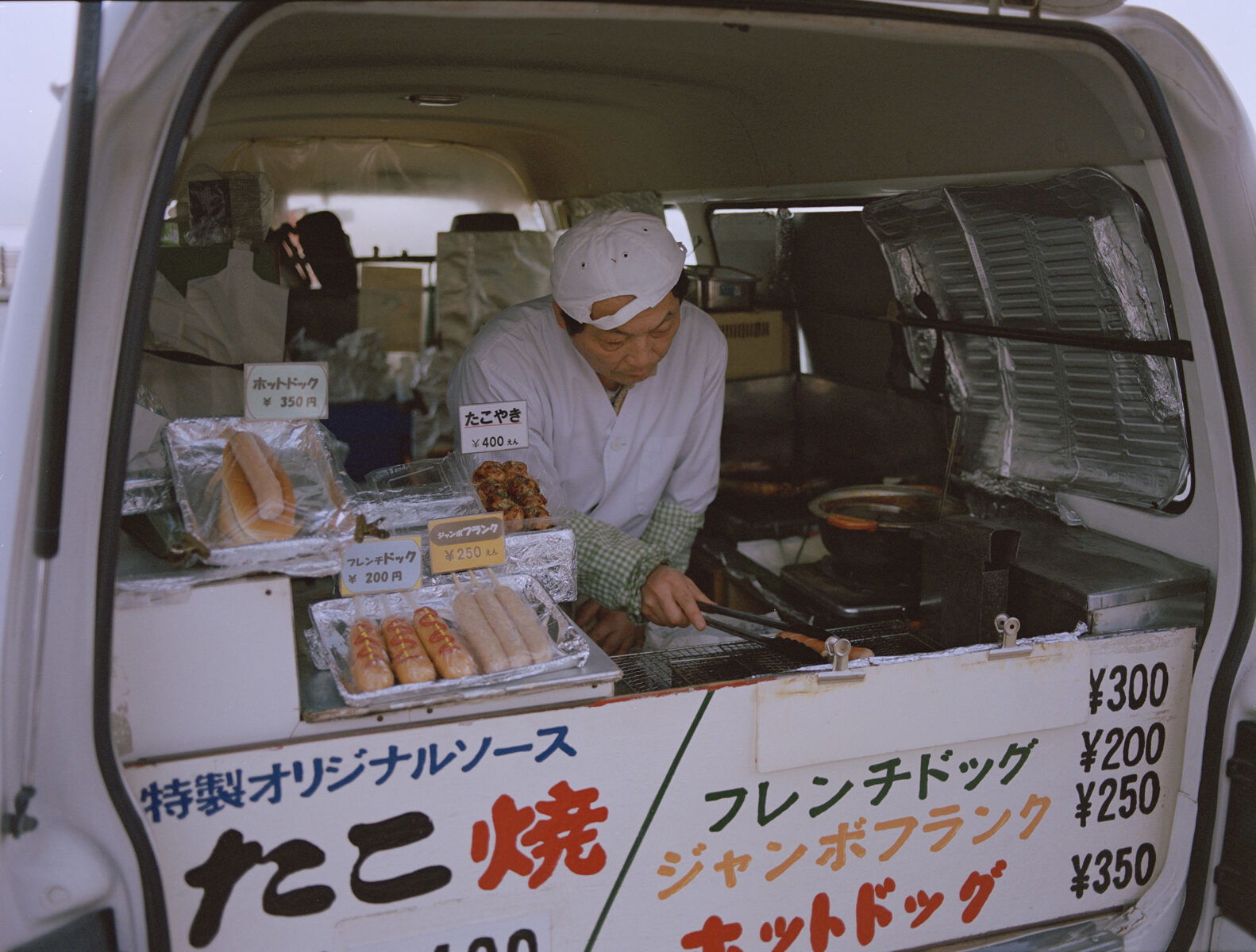 Photo of man in van in japan by Eric Chakeen