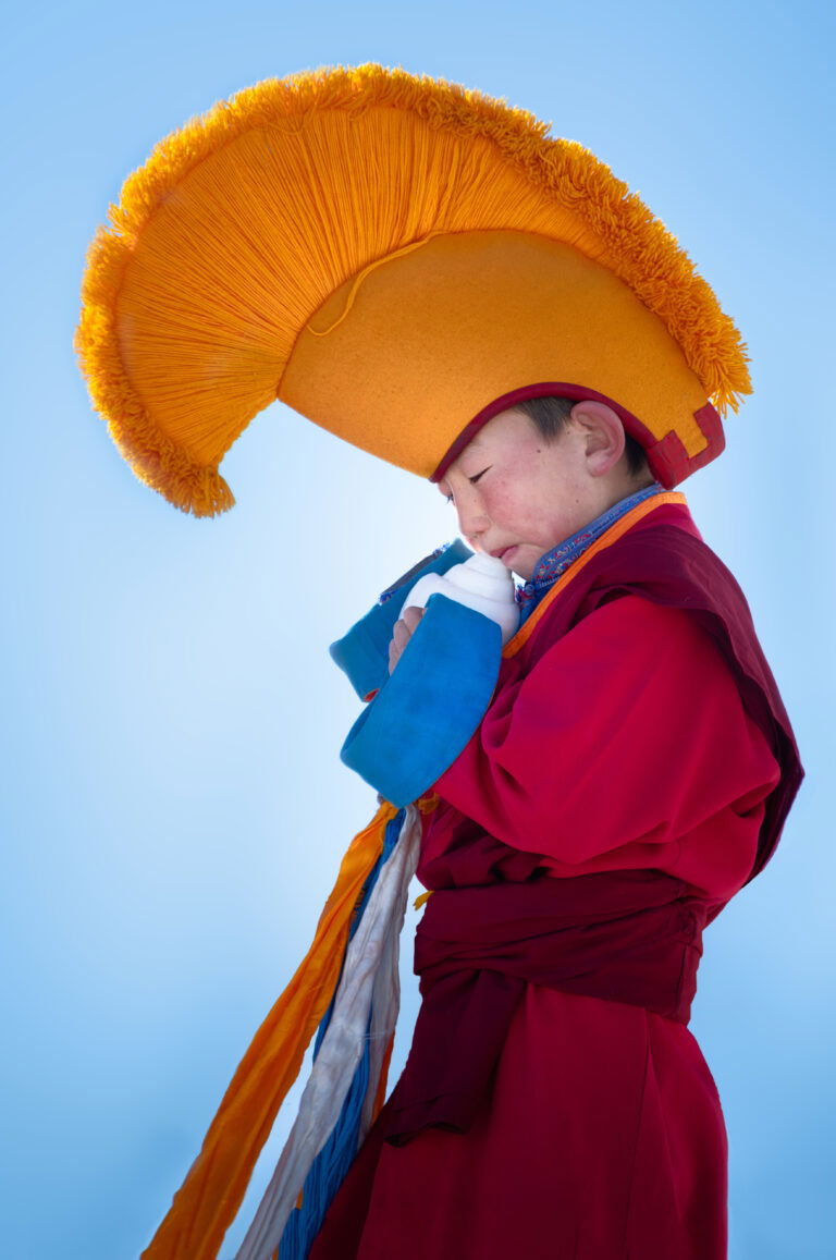 color portrait photography of a young monk in Erdene Zuu monastery, Mongolia by Diana Barthauer