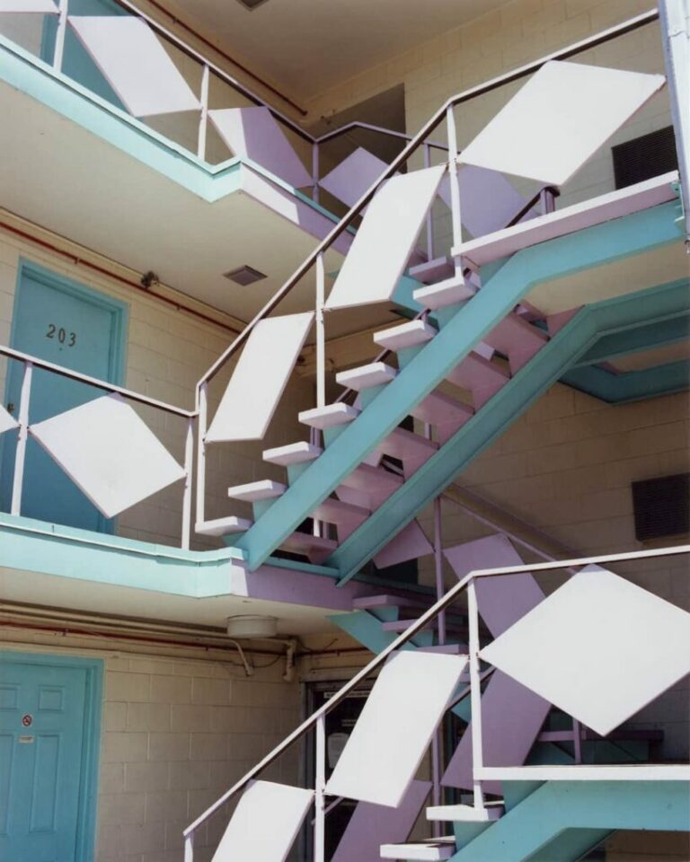 Photo a multi-story building with a blue and purple staircase by Gregory Halpern