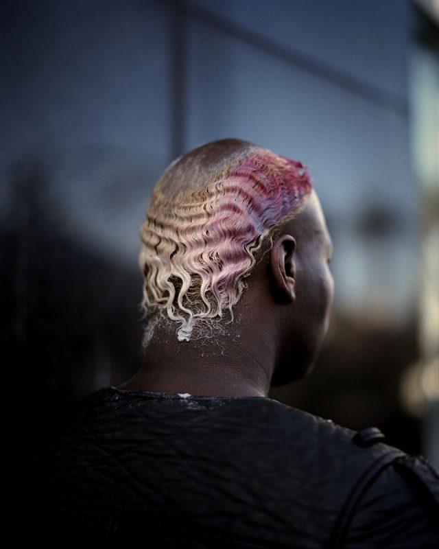 Portrait of a man with pink and blonde hair from behind by Gregory Halpern