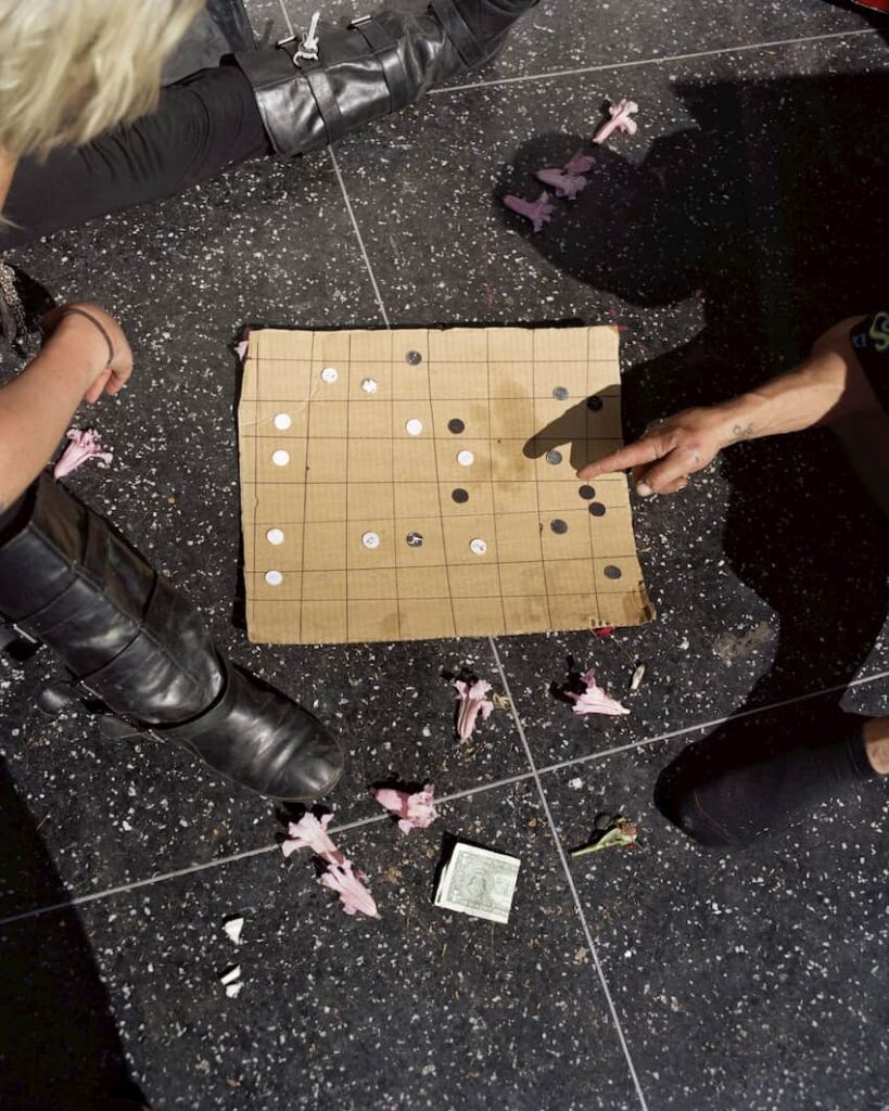 Photo a group of people playing a game by Gregory Halpern