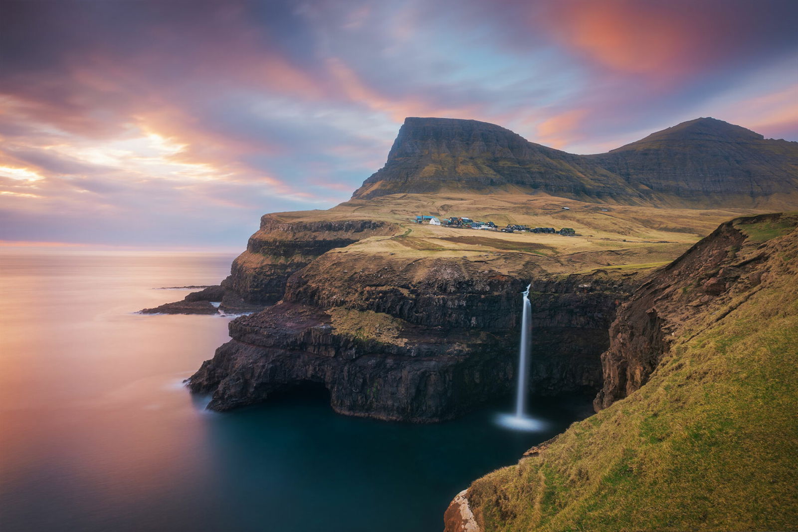 color landscape photo of Múlafossur Waterfall, Faroe Islands by Jennifer Esseiva