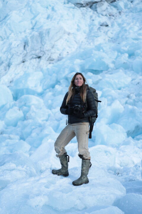 Portrait of photographer Jody MacDonald standing on ice field