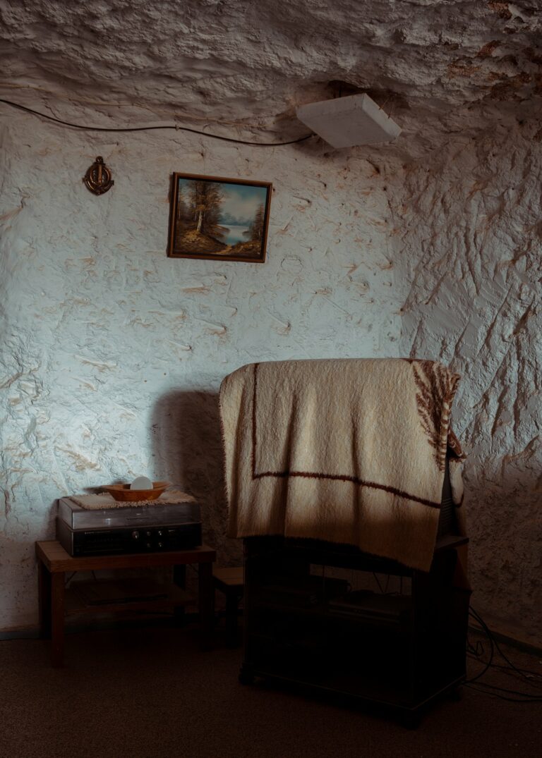 Documentary photography by Mattia Panunzio. Chair in the corner of a stone house