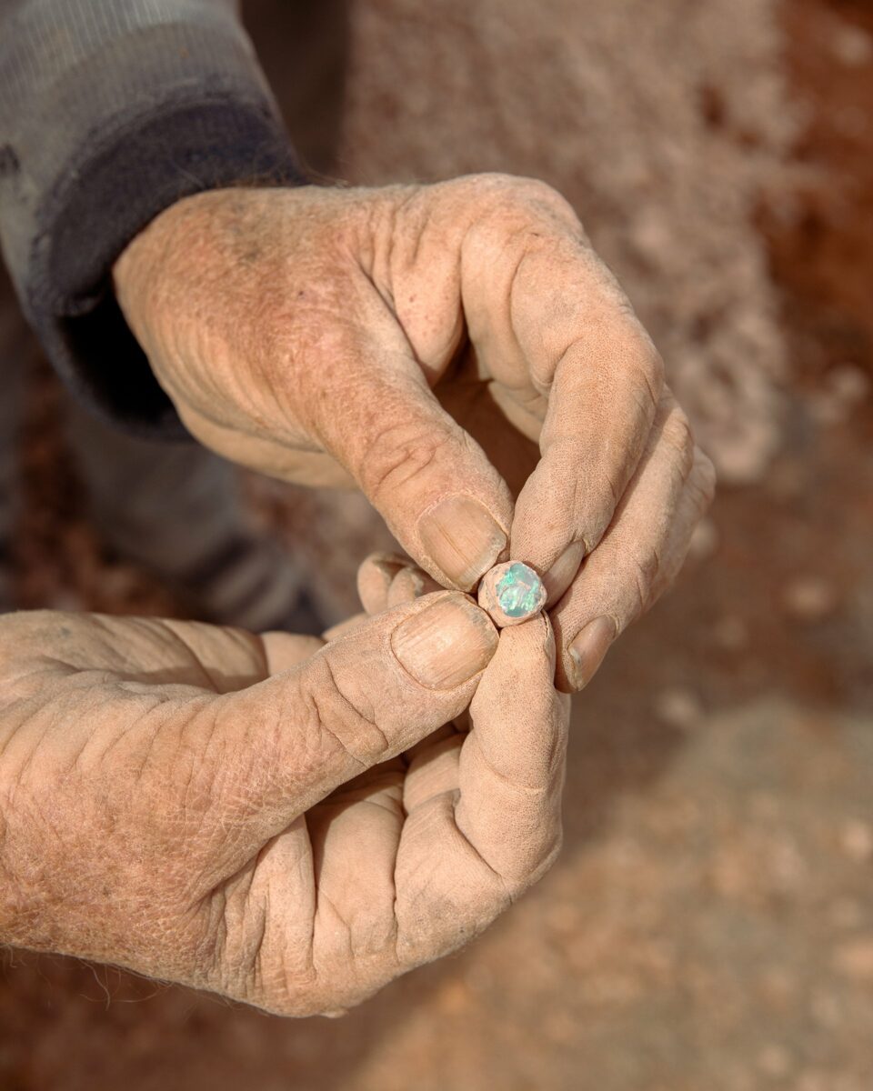 Documentary photography by Mattia Panunzio. Hands holding a piece of opal