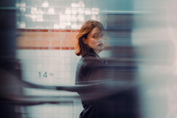 color street photo portrait of woman in New York subway by Billy Dinh