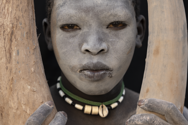 color fine art portrait of mundari boy by Maricruz Sainz De Aja