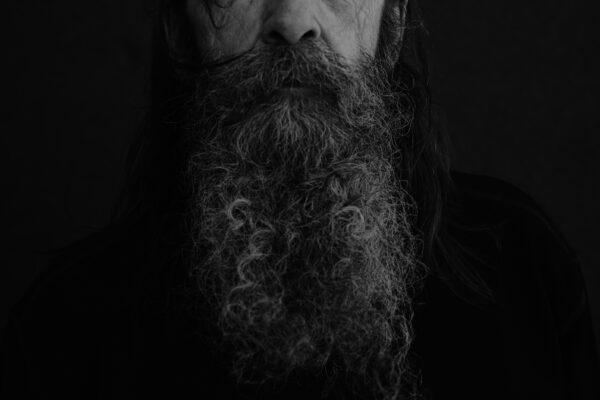 black and white portrait of man with beard by Joao Corredor