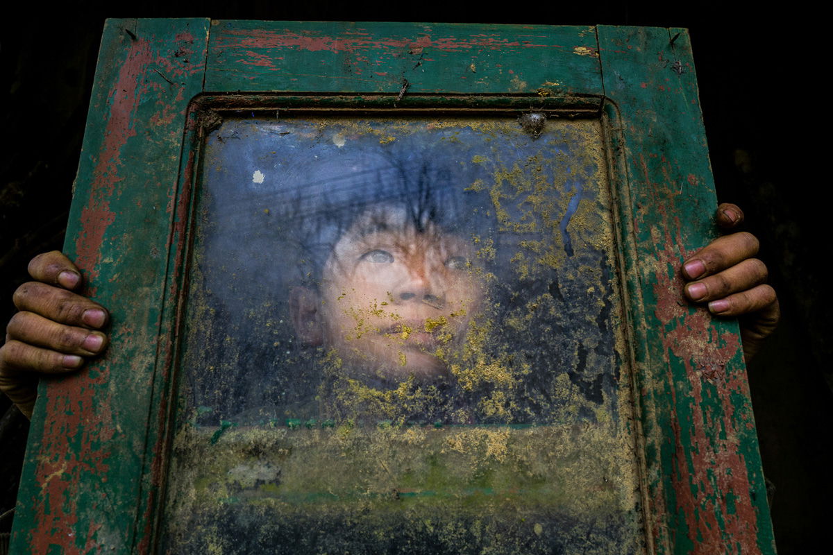 color documentary photo of young boy by Andrew Nguyen