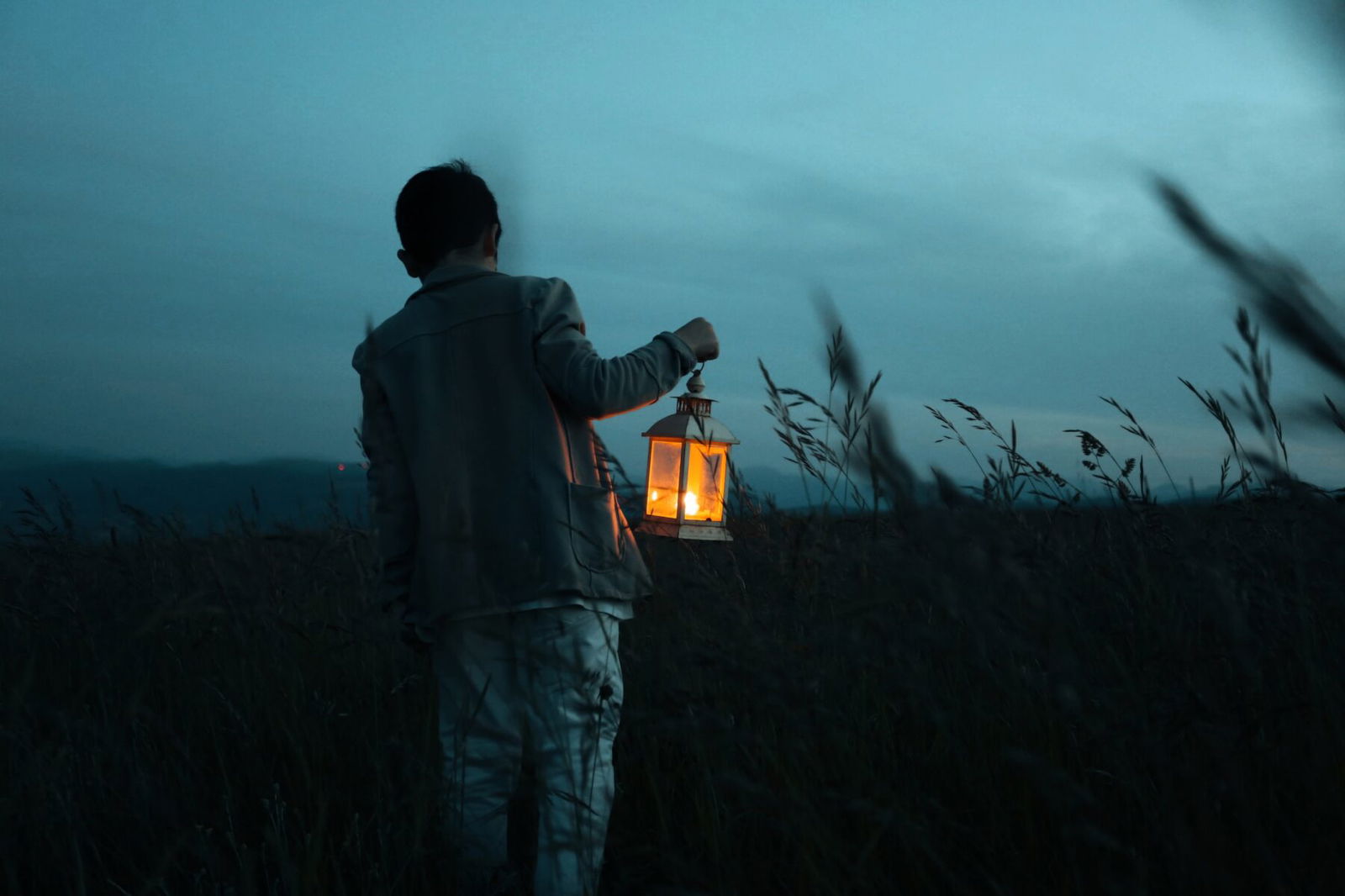 color fineart portrait of boy walking in field by Lucia Bottegoni