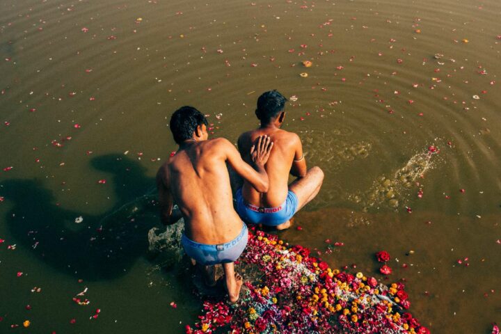 Photo of two men bathing in the ganges by Pie Aerts