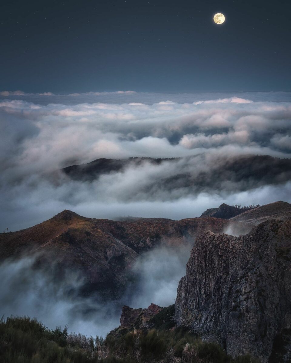 color photo of landscape over clouds in Madeira by Kai Hornung