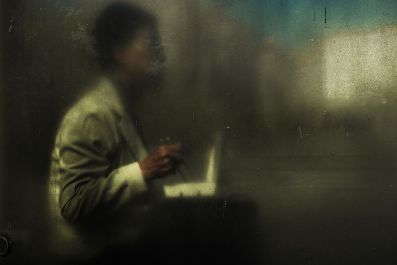 color street photo of reflexion of man in Taipei, Taiwan by Vladimir Khorev