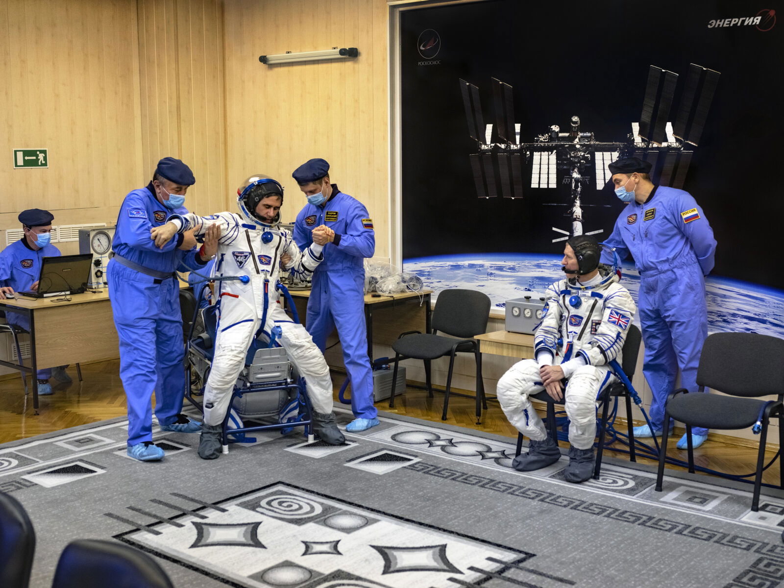 Documentary photography by Andrew McConnell. Yuri Malenchenko and Tim Peake have their spacesuits tested before launch