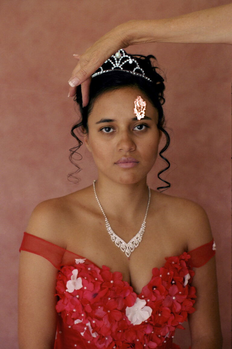 Portrait of a girl in a red dress and tiara by Marisol Mendez