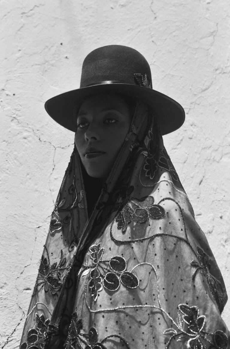 B&W photo of a Bolivian woman in a traditional hat by Marisol Mendez